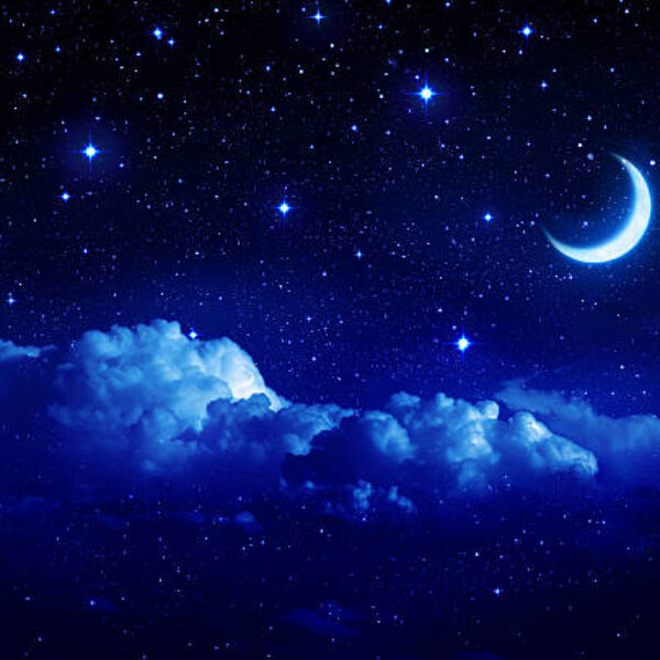 starry sky with half moon in scenic cloudscape